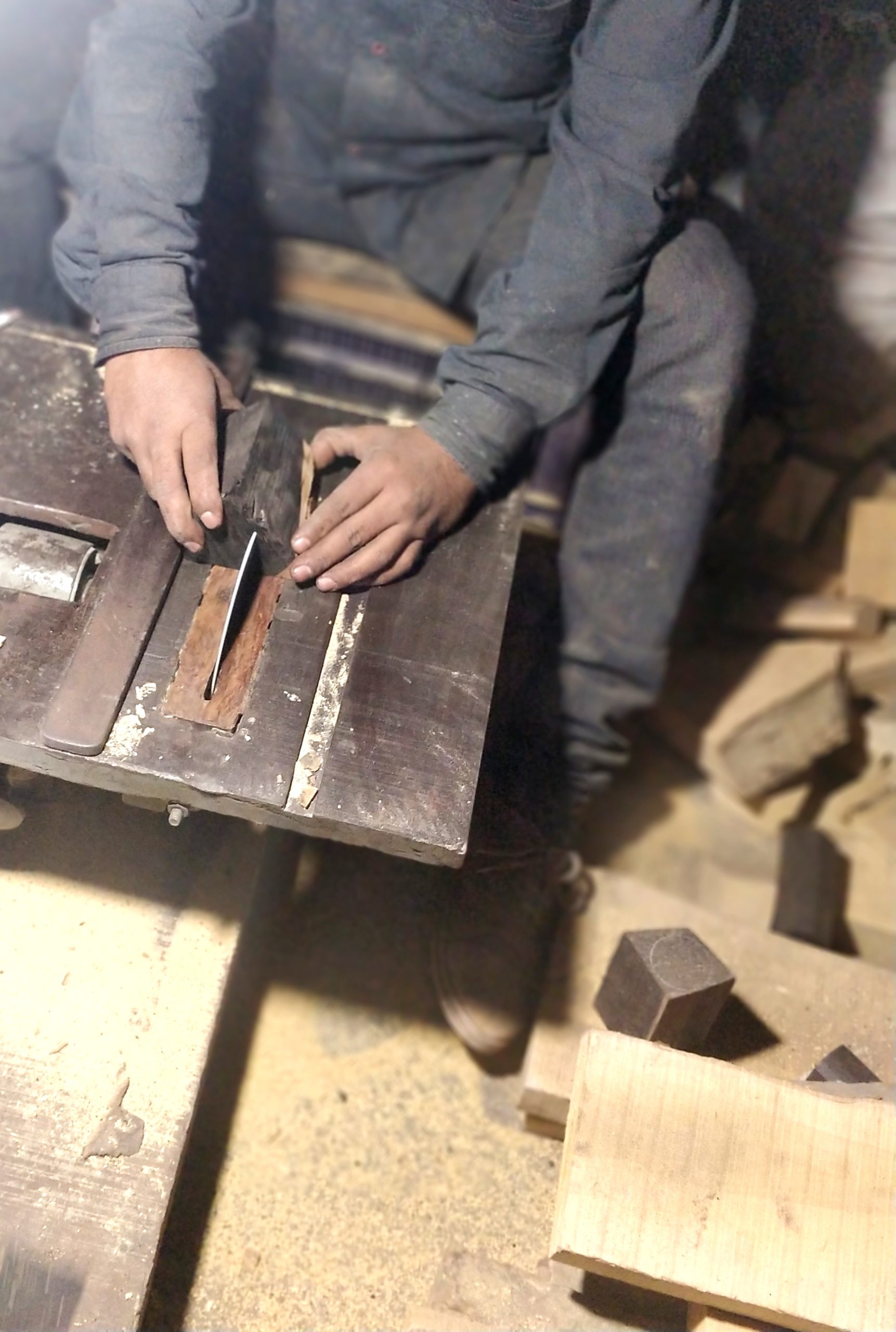 Ebony Wood on a machine for cutting