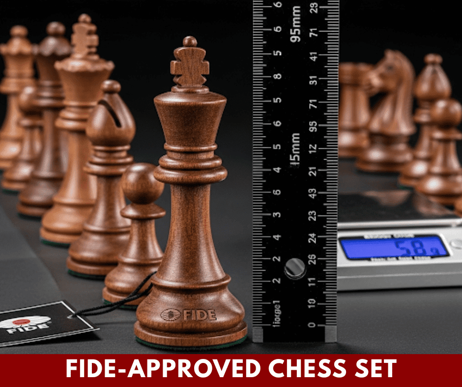 Official FIDE-approved Staunton tournament chess set with ruler measuring king size, illustrating chess piece weight standards and precise dimensions for competitive play